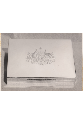 Hand engraved silver cigarette box, commissioned as a gift for Queen Elizabeth II’s visit to Melbourne in February 1954. Hand engraved silver cigarette box, commissioned as a gift for Queen Elizabeth II’s visit to Melbourne in February 1954.